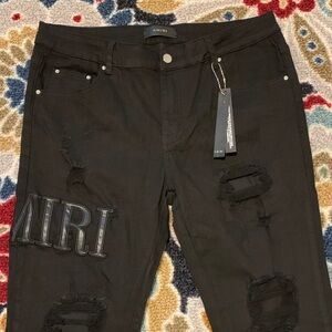 AMIRI Black Distressed Skinny Jeans